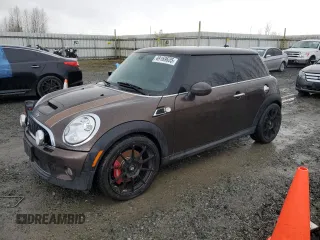 2010 MINI Hardtop S with VIN WMWMF7C59ATX45035, listed as a Copart auction lot 49169635 with 203,743 mi miles and Salvage Title. Bid and sale history available at DreamBid. Image 1.
