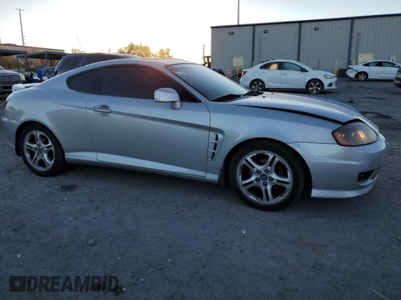 2005 Hyundai Tiburon GT z VIN KMHHN65F05U171038, wystawiony jako Copart lot #87765735 z przebiegiem 113 129 mil mil oraz Szkoda całkowita • Salvage title. Historia ofert i sprzedaży dostępna na DreamBid. Obrazek 4.