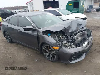 2019 Honda Civic Si z VIN 2HGFC1E52KH701117, wystawiony jako IAAI lot #41722505 z przebiegiem 64 085 mil mil oraz . Historia ofert i sprzedaży dostępna na DreamBid. Obrazek 1.