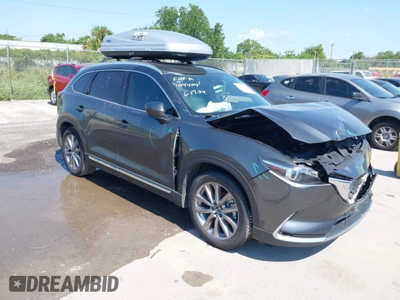 2022 Mazda CX-9 Grand Touring with VIN JM3TCBDY4N0618680, listed as a IAAI auction lot 40086806 with 34,142 mi miles and . Bid and sale history available at DreamBid. Image 1.