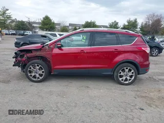 2016 Ford Escape Titanium with VIN 1FMCU9JX2GUA89716, listed as a IAAI auction lot 41899786 with 85,474 mi miles and . Bid and sale history available at DreamBid. Image 14.