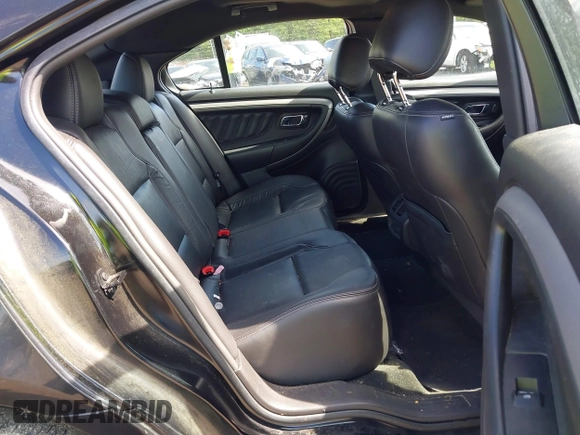 2015 Ford Taurus SEL with VIN 1FAHP2E88FG181055, listed as a IAAI auction lot 42307640 with 104,702 mi miles and . Bid and sale history available at DreamBid. Image 8.
