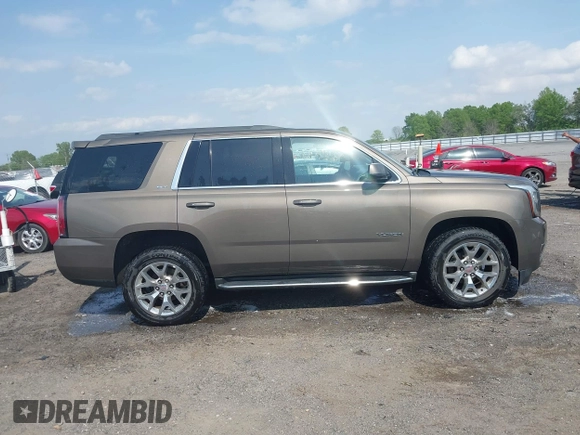 2016 GMC Yukon SLT with VIN 1GKS1BKC9GR328861, listed as a IAAI auction lot 42010839 with 200,711 mi miles. Bid and sale history available at carsss.com. Image 13.