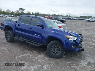2023 Toyota Tacoma SR with VIN 3TMCZ5AN2PM569644, listed as a IAAI auction lot 41753562 with 16,945 mi miles and . Bid and sale history available at DreamBid. Image 1.