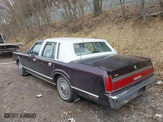 1987 Lincoln Town Car with VIN 1LNBM81F5HY704217, listed as a IAAI auction lot 41855678 with 86,794 mi miles. Bid and sale history available at carsss.com. Image 3.