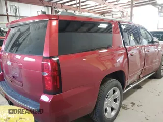 2015 Chevrolet Suburban LTZ z VIN 1GNSKKKC7FR218034, wystawiony jako IAAI lot #41884644 z przebiegiem 160 721 mil mil oraz . Historia ofert i sprzedaży dostępna na DreamBid. Obrazek 4.
