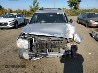 2009 Jeep Grand Cherokee Laredo with VIN 1J8HR48P39C559192, listed as a Copart auction lot 74007094 with 105,997 mi miles and Salvage Title. Bid and sale history available at carsss.com. Image 5.