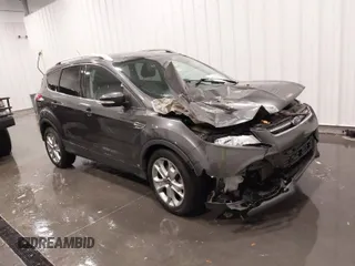 2015 Ford Escape Titanium with VIN 1FMCU0J97FUC25446, listed as a IAAI auction lot 41708585 with 150,010 mi miles. Bid and sale history available at carsss.com. Image 1.