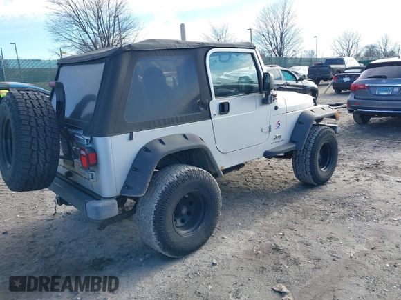 2003 Jeep Wrangler X with VIN 1J4FA39S33P363153, listed as a IAAI auction lot 41584805 with 160,676 mi miles. Bid and sale history available at carsss.com. Image 4.