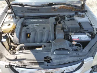 2008 Kia Optima LX z VIN KNAGE123185190108, wystawiony jako Copart lot #59364195 z przebiegiem 131 344 mil mil oraz Szkoda całkowita • Salvage title. Historia ofert i sprzedaży dostępna na DreamBid. Obrazek 11.