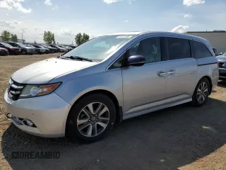 2014 Honda Odyssey Touring with VIN 5FNRL5H91EB502555, listed as a Copart auction lot 61872285 with 203,448 mi miles and Salvage title. Bid and sale history available at DreamBid. Image 1.