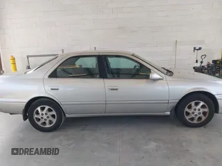 2000 Toyota Camry LE z VIN JT2BF22K2Y0239961, wystawiony jako IAAI lot #42128226 z przebiegiem 154 691 mil mil oraz . Historia ofert i sprzedaży dostępna na DreamBid. Obrazek 13.