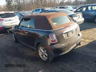 2011 MINI Convertible with VIN WMWZN3C55BT133367, listed as a IAAI auction lot 41781374 with 124,036 mi miles and . Bid and sale history available at DreamBid. Image 3.
