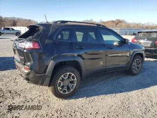 2022 Jeep Cherokee Trailhawk with VIN 1C4PJMBX5ND549237, listed as a Copart auction lot 83760264 with 24,756 mi miles and Salvage Title. Bid and sale history available at carsss.com. Image 3.