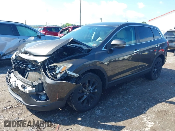 2015 Mazda CX-9 Grand Touring z VIN JM3TB3DV8F0465155, wystawiony jako IAAI lot #42366636 z przebiegiem 125 407 mil mil oraz . Historia ofert i sprzedaży dostępna na DreamBid. Obrazek 2.