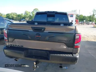 2021 Nissan Titan SV with VIN 1N6AA1ED1MN523973, listed as a IAAI auction lot 42406382 with 73,688 mi miles and . Bid and sale history available at DreamBid. Image 16.