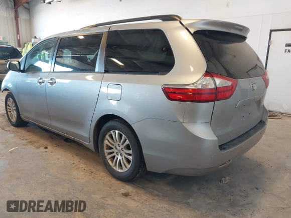 2015 Toyota Sienna XLE with VIN 5TDYK3DCXFS534633, listed as a IAAI auction lot 42018593 with 128,421 mi miles. Bid and sale history available at carsss.com. Image 3.