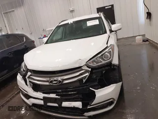 2017 Hyundai Santa Fe 2.4L z VIN 5XYZU3LBXHG444308, wystawiony jako IAAI lot #41685902 z przebiegiem 70 838 mil mil oraz . Historia ofert i sprzedaży dostępna na DreamBid. Obrazek 12.