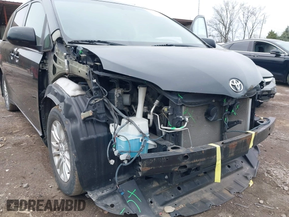 2011 Toyota Sienna XLE AAS with VIN 5TDYK3DC9BS071636, listed as a IAAI auction lot 41972332 with 204,477 mi miles and . Bid and sale history available at DreamBid. Image 6.