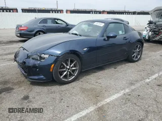 2021 Mazda MX-5 Miata Grand Touring with VIN JM1NDAM70M0460532, listed as a Copart auction lot 58828045 with 70,269 mi miles and Salvage title. Bid and sale history available at DreamBid. Image 1.