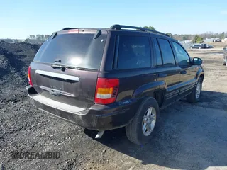 2004 Jeep Grand Cherokee with VIN 1J8GX48S24C266933, listed as a IAAI auction lot 41497122 with 200,899 mi miles and . Bid and sale history available at DreamBid. Image 4.