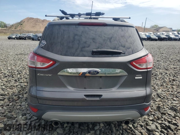 2013 Ford Escape SEL z VIN 1FMCU9HX6DUB05689, wystawiony jako Copart lot #55148765 z przebiegiem 69 178 mil mil oraz Czysty tytuł • Clean title. Historia ofert i sprzedaży dostępna na DreamBid. Obrazek 6.