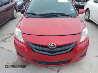 2007 Toyota Yaris with VIN JTDBT903071077664, listed as a IAAI auction lot 42175827 with 154,079 mi miles. Bid and sale history available at carsss.com. Image 6.