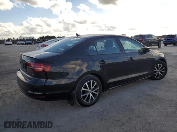 2016 Volkswagen Jetta Sedan 1.4T SE with VIN 3VWD67AJ0GM390490, listed as a Copart auction lot 44711055 with 185,046 mi miles and Salvage Title. Bid and sale history available at carsss.com. Image 3.