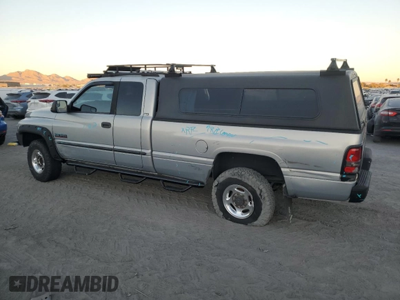 2000 Dodge 2500 z VIN 1B7KF2369YJ144753, wystawiony jako Copart lot #80801414 z przebiegiem 173 413 mil mil oraz Szkoda całkowita • Salvage title. Historia ofert i sprzedaży dostępna na DreamBid. Obrazek 2.