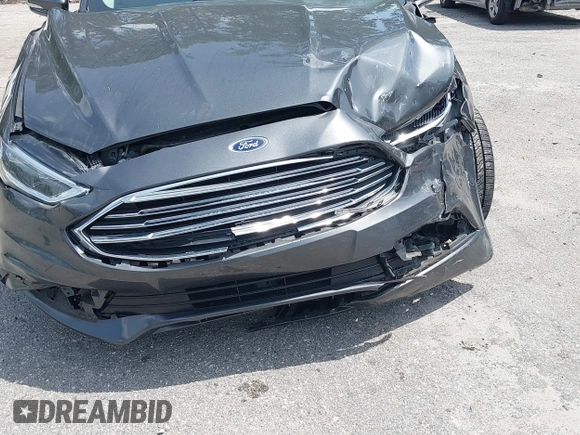 2018 Ford Fusion Titanium with VIN 3FA6P0D9XJR169657, listed as a IAAI auction lot 42392112 with 62,754 mi miles and . Bid and sale history available at DreamBid. Image 6.
