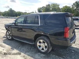 2015 Chevrolet Tahoe LTZ with VIN 1GNSCCKC2FR693500, listed as a Copart auction lot 60225195 with 206,210 mi miles and Salvage title. Bid and sale history available at DreamBid. Image 2.