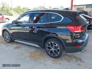 2021 BMW X1 sDrive28i with VIN WBXJG7C02M5S59010, listed as a IAAI auction lot 41933532 with 49,207 mi miles. Bid and sale history available at carsss.com. Image 14.