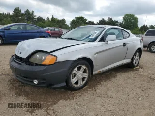 2003 Hyundai Tiburon z VIN KMHHM65D43U017995, wystawiony jako Copart lot #56498665 z przebiegiem 162 820 mil mil oraz Szkoda całkowita • Salvage title. Historia ofert i sprzedaży dostępna na DreamBid. Obrazek 1.