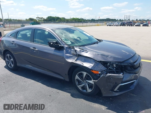 2020 Honda Civic LX with VIN 19XFC2F68LE007735, listed as a IAAI auction lot 42215294 with 3,849 mi miles and . Bid and sale history available at DreamBid. Image 1.