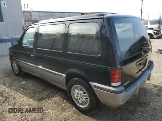 1991 Dodge Caravan z VIN 2B4GK55R6MR136865, wystawiony jako Copart lot #83209824 z przebiegiem 44 931 mil mil oraz Tytuł czysty. Historia ofert i sprzedaży dostępna na DreamBid. Obrazek 2.