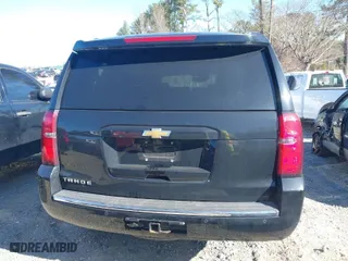 2015 Chevrolet Tahoe LTZ with VIN 1GNSKCKC3FR222135, listed as a IAAI auction lot 41816033 with 180,393 mi miles. Bid and sale history available at carsss.com. Image 16.