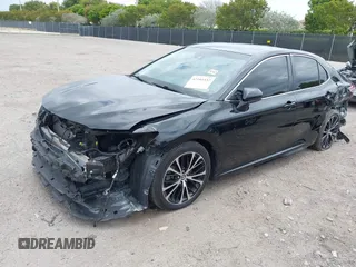 2018 Toyota Camry LE z VIN 4T1B11HK6JU158382, wystawiony jako IAAI lot #42185532 z przebiegiem 94 802 mil mil oraz . Historia ofert i sprzedaży dostępna na DreamBid. Obrazek 18.
