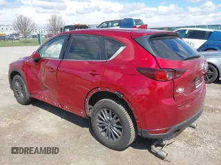 2021 Mazda CX-5 Touring z VIN JM3KFBCM1M0401717, wystawiony jako IAAI lot #42036407 z przebiegiem 35 587 mil mil oraz . Historia ofert i sprzedaży dostępna na DreamBid. Obrazek 3.