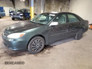 2002 Toyota Camry LE z VIN 4T1BE30K92U518161, wystawiony jako Copart lot #57880625 z przebiegiem 179 721 mil mil oraz Szkoda całkowita • Salvage title. Historia ofert i sprzedaży dostępna na DreamBid. Obrazek 1.