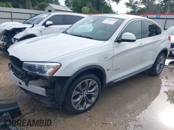 2015 BMW X4 xDrive28i with VIN 5UXXW3C51F0M86668, listed as a IAAI auction lot 42489071 with 59,694 mi miles and . Bid and sale history available at DreamBid. Image 18.