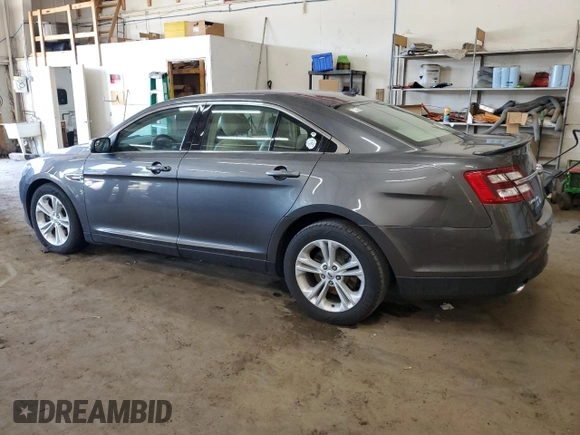 2015 Ford Taurus SEL with VIN 1FAHP2E84FG102318, listed as a Copart auction lot 61744685 with 82,149 mi miles and Salvage title. Bid and sale history available at DreamBid. Image 2.