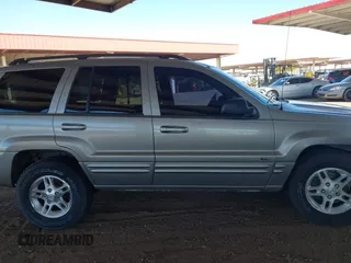 2000 Jeep Grand Cherokee Limited z VIN 1J4GW58N1YC206992, wystawiony jako IAAI lot #42057236 z przebiegiem 183 986 mil mil oraz . Historia ofert i sprzedaży dostępna na DreamBid. Obrazek 13.