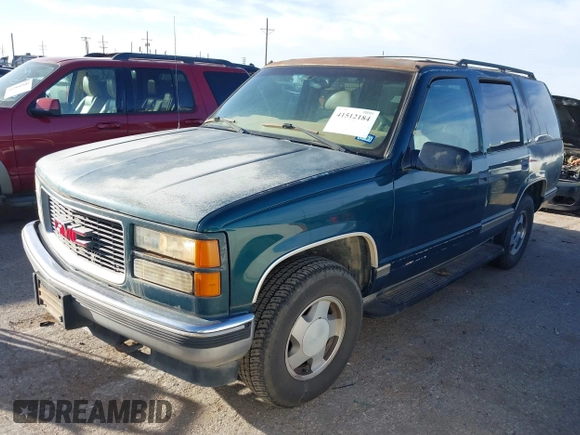 1997 GMC Yukon with VIN 1GKEK13R1VJ723409, listed as a IAAI auction lot 41512184 with 235,988 mi miles. Bid and sale history available at carsss.com. Image 2.
