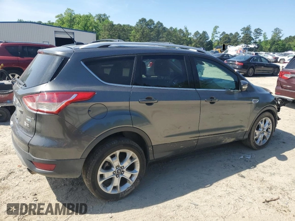2015 Ford Escape Titanium with VIN 1FMCU9J92FUC74879, listed as a Copart auction lot 54683185 with 143,436 mi miles and Salvage title. Bid and sale history available at DreamBid. Image 3.