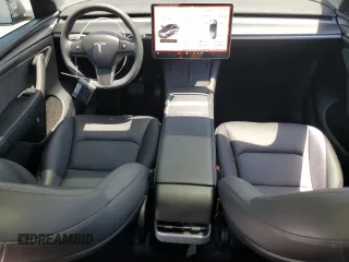 2024 Tesla Model Y Long Range with VIN 7SAYGDEE0RA288420, listed as a Copart auction lot 59159015 with 7,831 mi miles and Salvage title. Bid and sale history available at DreamBid. Image 8.