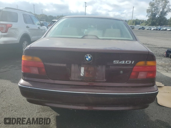 1997 BMW 5 Series 540i z VIN WBADE6320VBW54072, wystawiony jako Copart lot #74403104 z przebiegiem 98 910 mil mil oraz Czysty tytuł • Clean title. Historia ofert i sprzedaży dostępna na DreamBid. Obrazek 6.