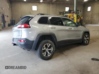 2014 Jeep Cherokee Trailhawk with VIN 1C4PJMBSXEW213981, listed as a Copart auction lot 60440495 with 136,612 mi miles and Salvage title. Bid and sale history available at DreamBid. Image 3.