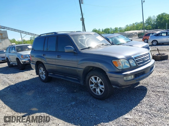 2003 Lexus LX with VIN JTJHT00W233532297, listed as a IAAI auction lot 42189676 with 235,992 mi miles. Bid and sale history available at carsss.com. Image 1.