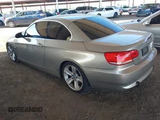 2007 BMW 3 Series 335i with VIN WBAWL73517PX46117, listed as a IAAI auction lot 40208424 with 117,045 mi miles. Bid and sale history available at carsss.com. Image 3.