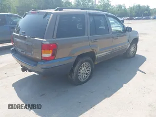 2002 Jeep Grand Cherokee Limited z VIN 1J8GW58N62C213751, wystawiony jako IAAI lot #42478869 z przebiegiem 233 848 mil mil oraz . Historia ofert i sprzedaży dostępna na DreamBid. Obrazek 4.